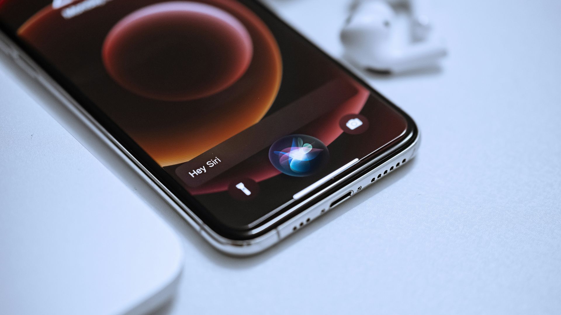 Black Android smartphone lying on a white table