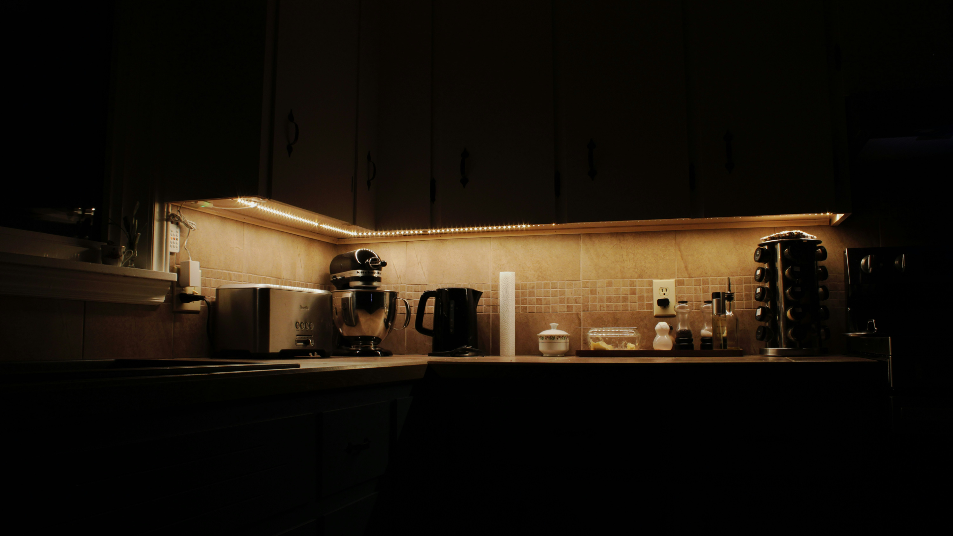 Practical kitchen setup with black cabinetry and everyday appliances