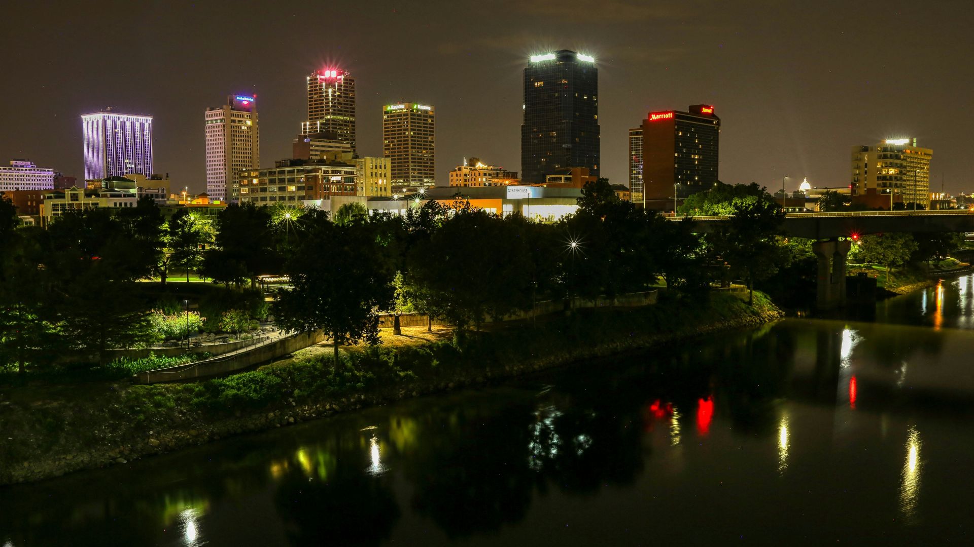 Arkansas city skyline at night with illuminated buildings