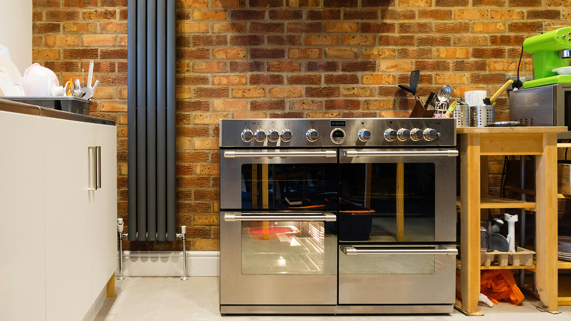 Contemporary kitchen with stainless steel appliances and mixed textures