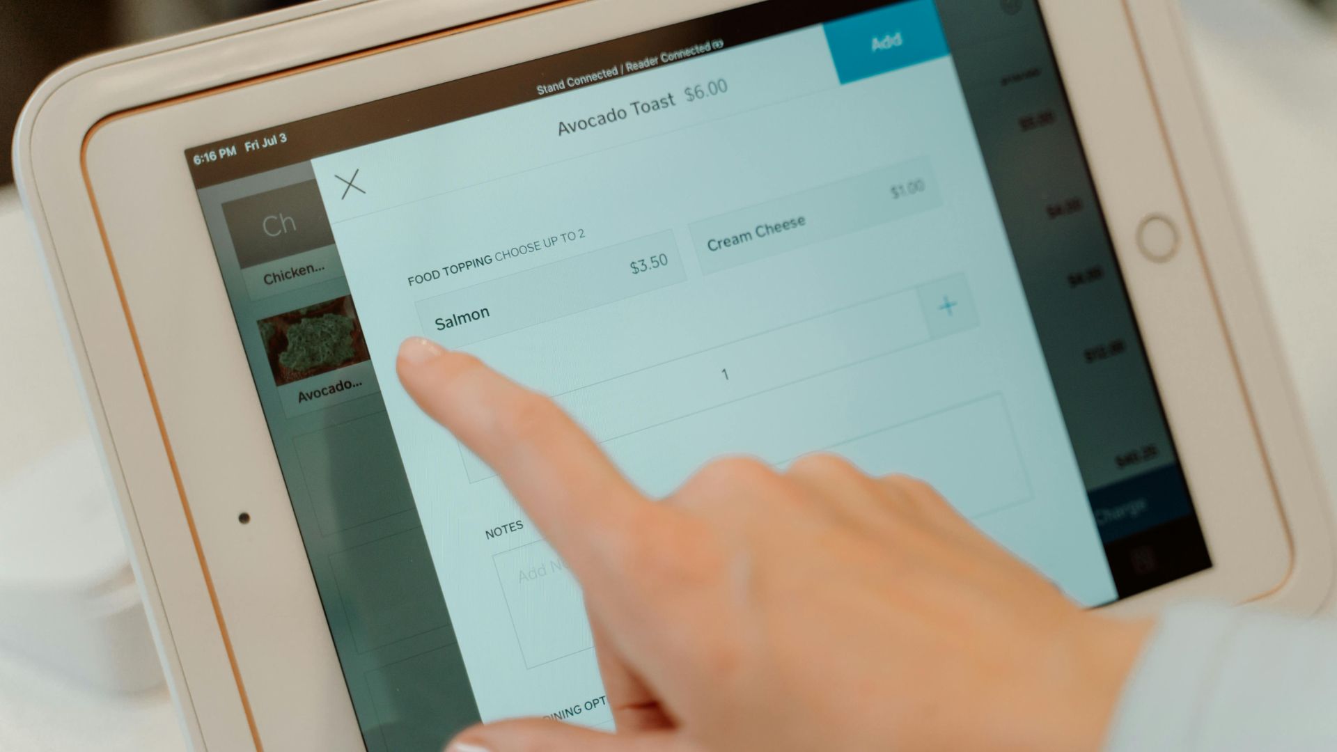 Close-up of an iPad showing financial data and charts