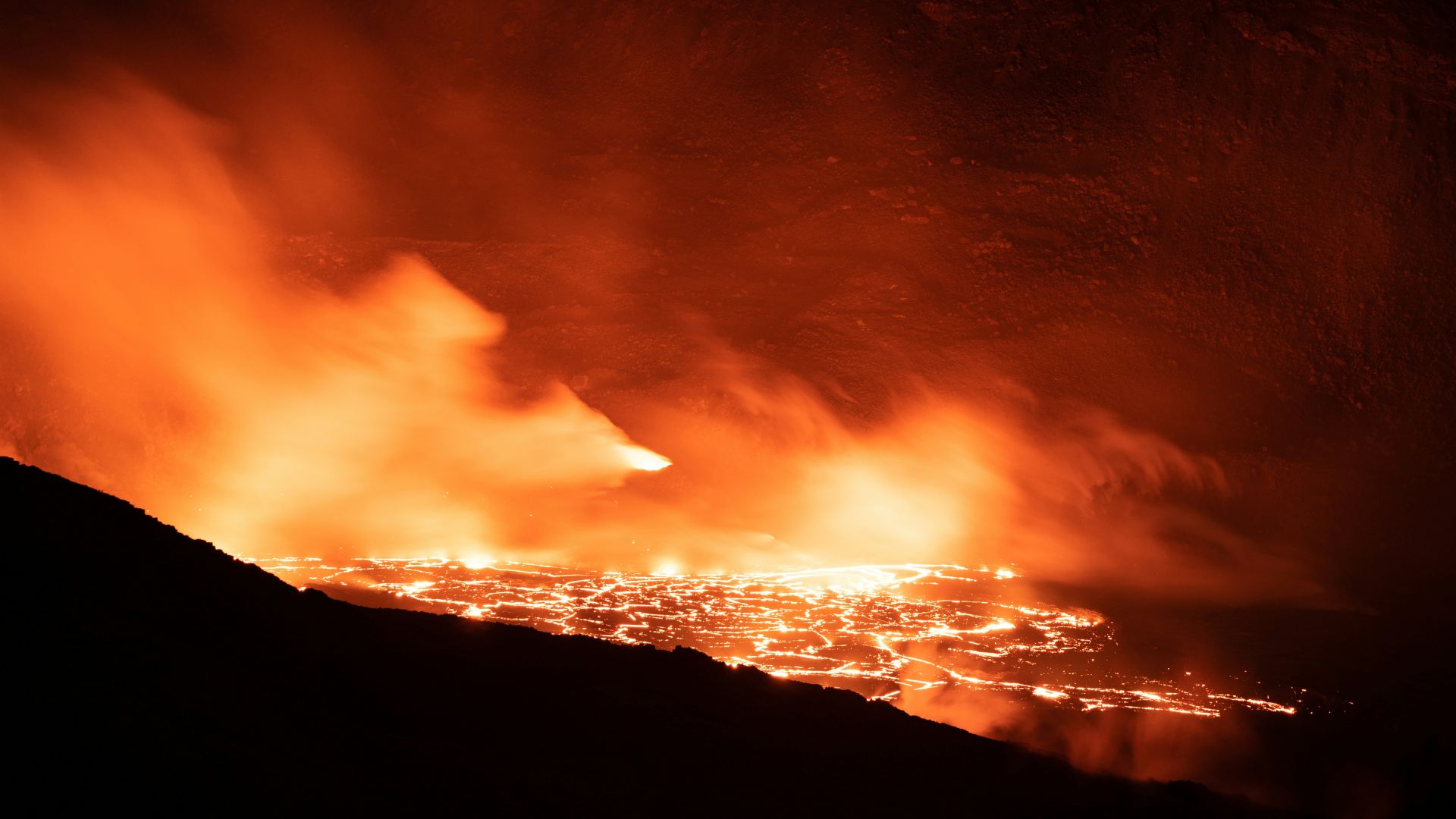 Dark atmospheric image showing thick clouds illuminated by faint light symbolizing Venus’s cloudy sky