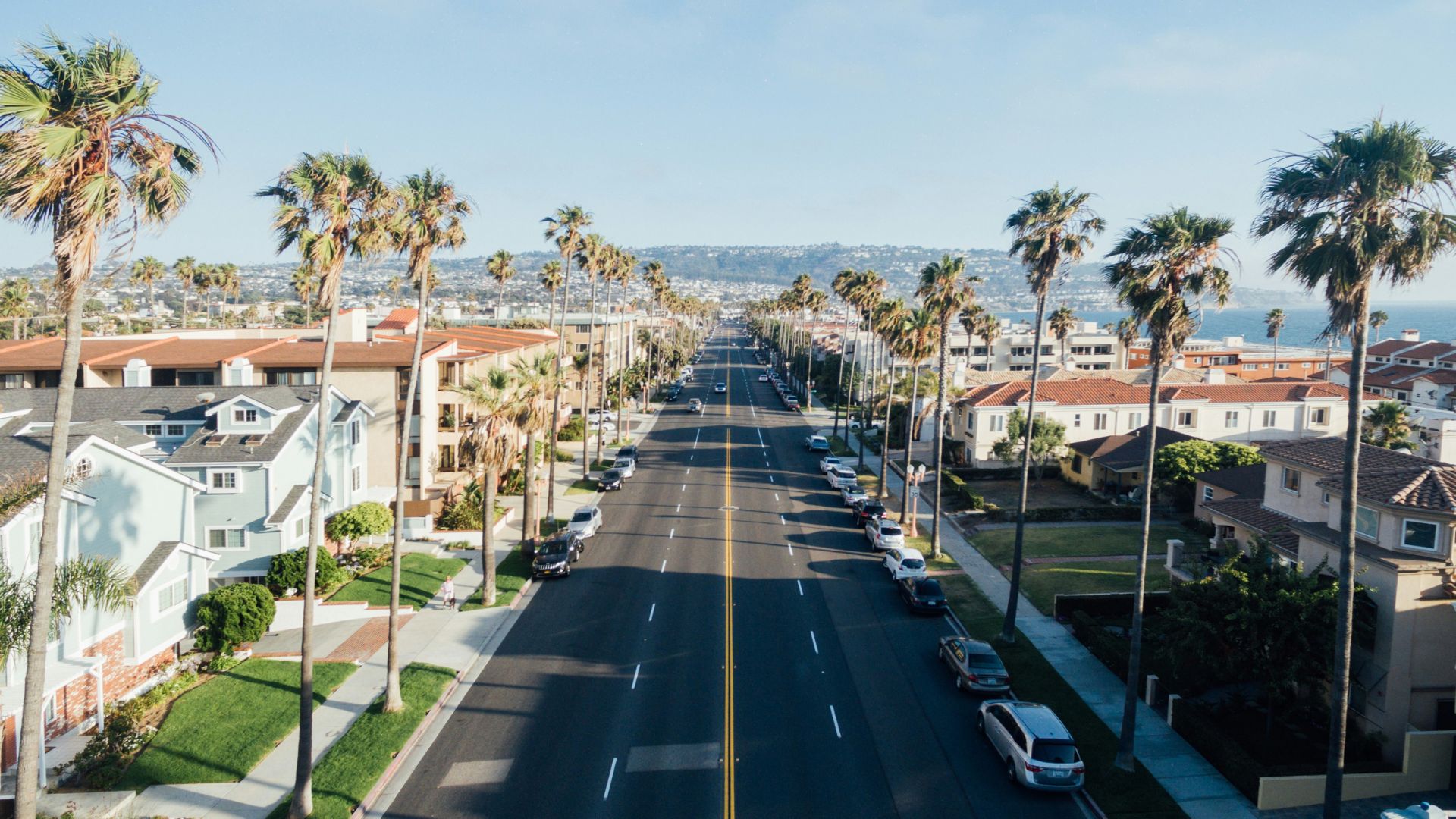 Aerial view of cars driving along a busy city street
