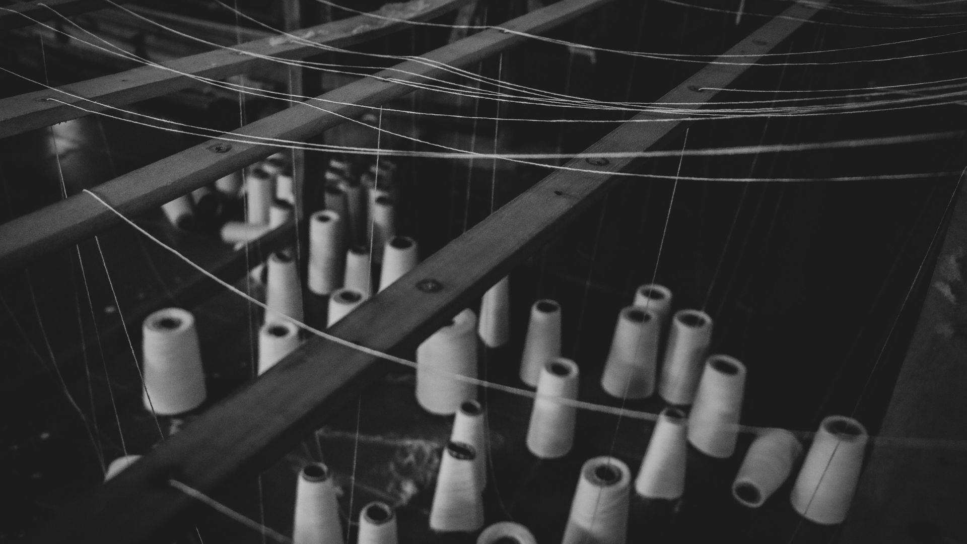 Close-up of industrial metal bars forming part of a machine frame