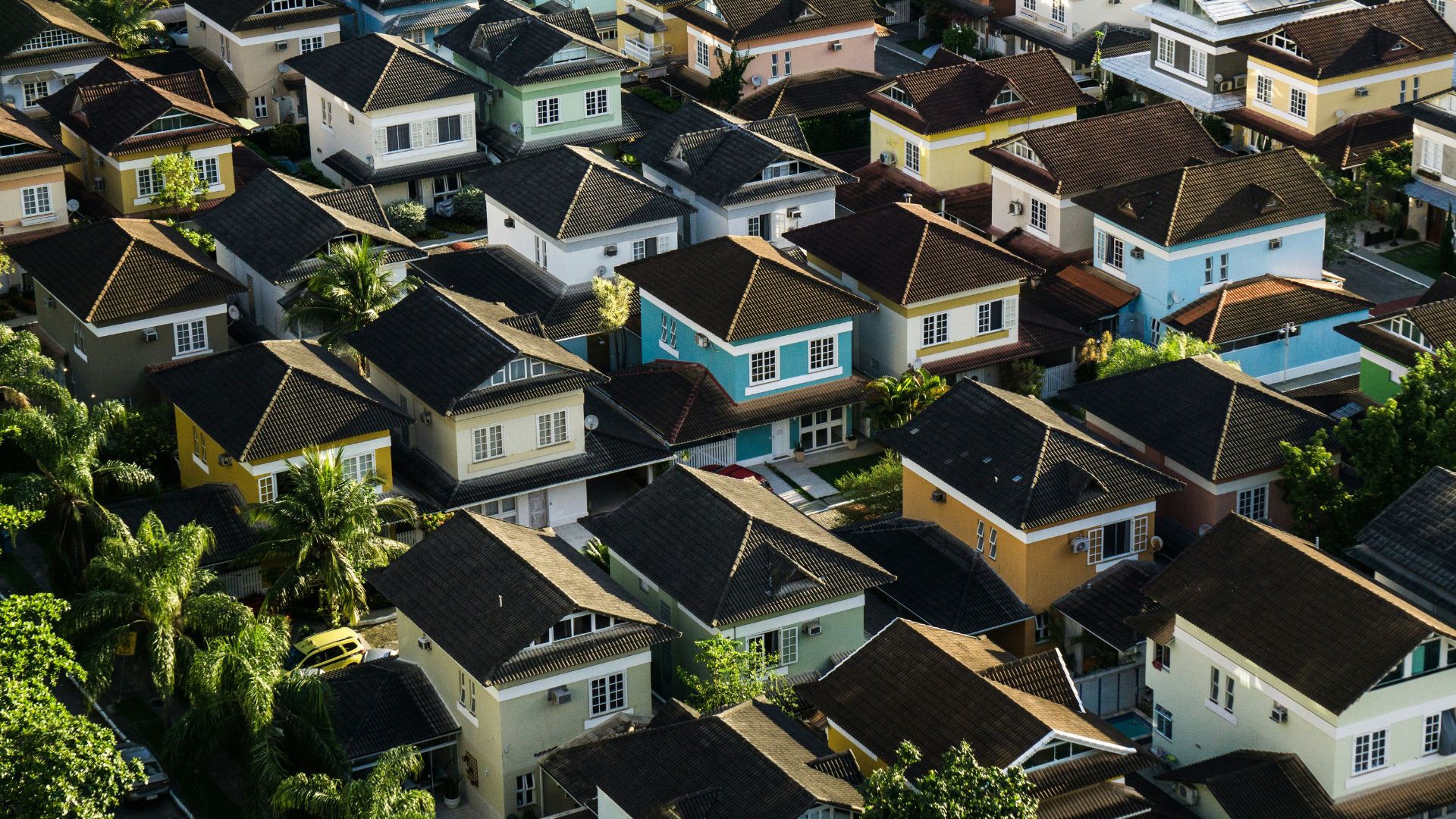 Aerial view of suburban homes and open fields