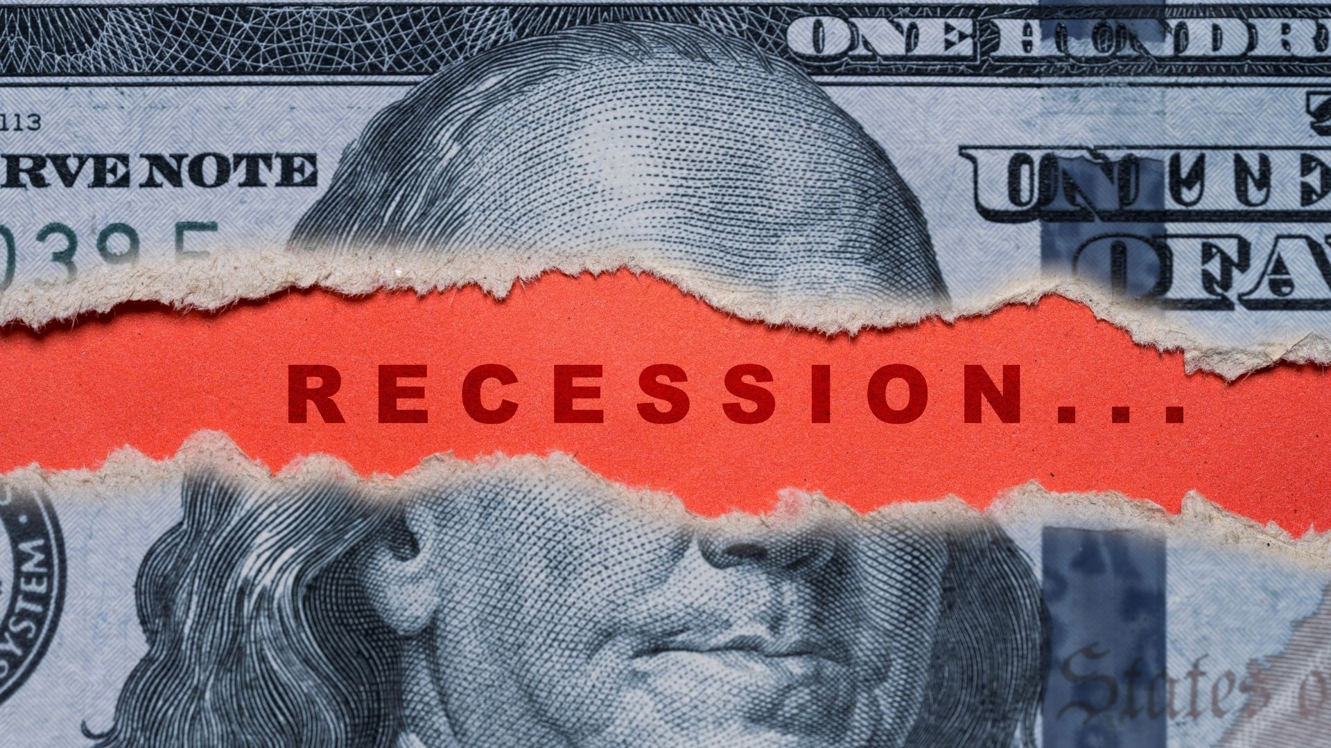 Torn US dollar banknote with the word “Recession” printed across it
