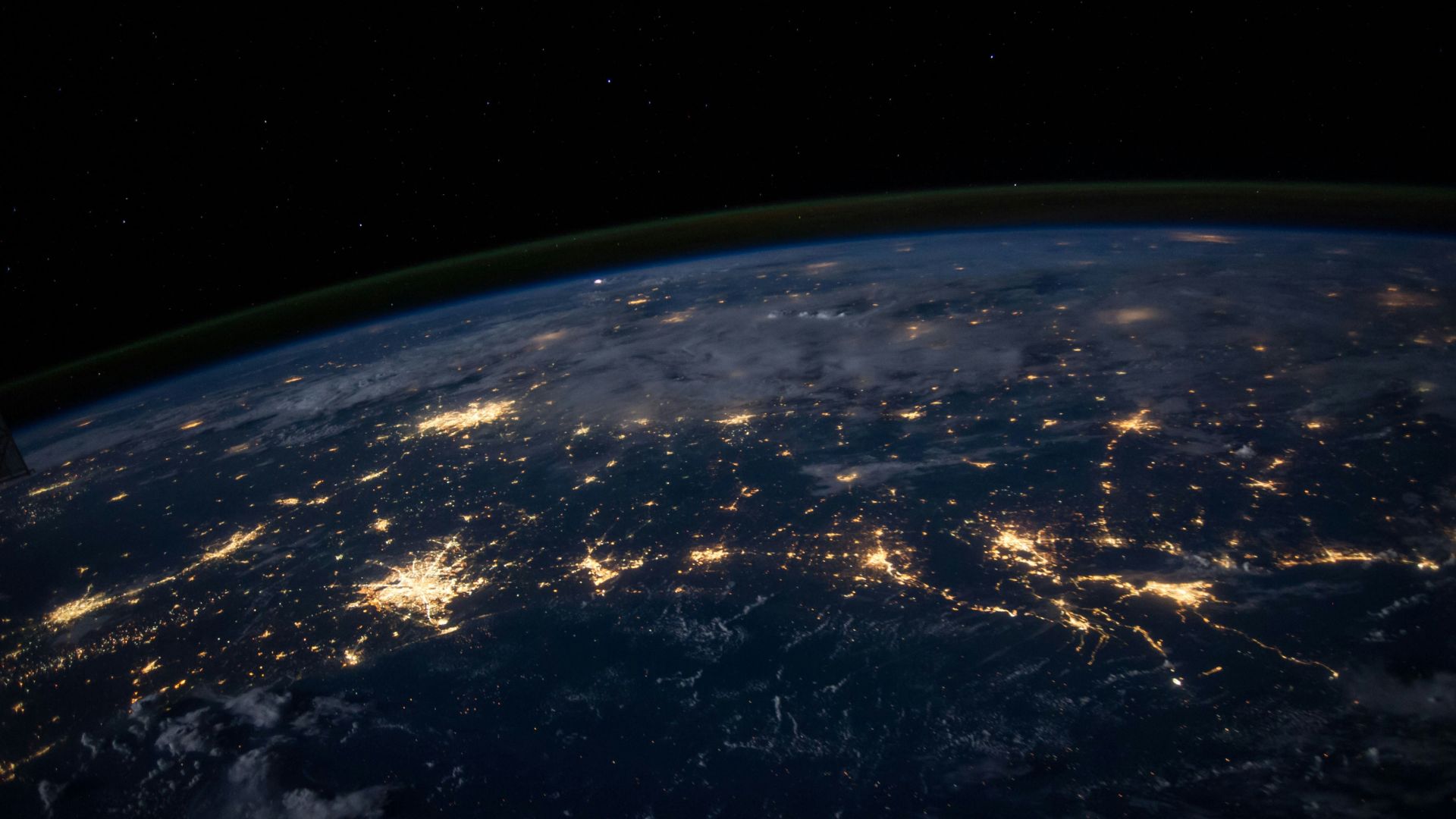 Outer space photograph showing a glowing planet surrounded by stars representing early planetary formation