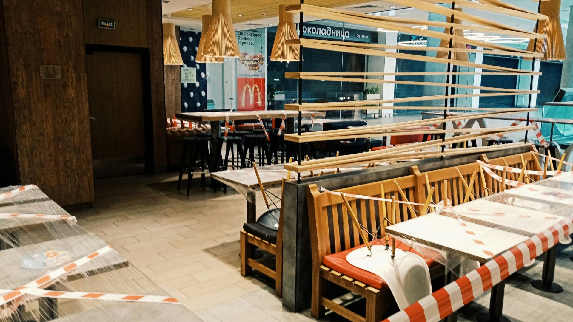 Restaurant with orange and white barriers outside its entrance