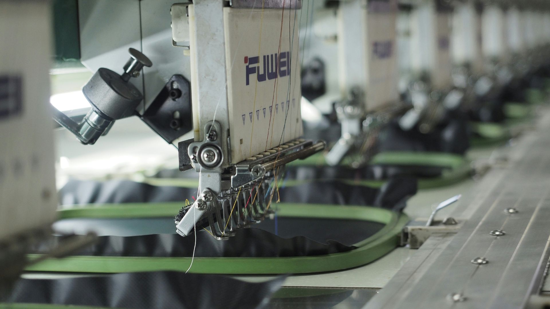 Close-up of a sewing machine being used to stitch fabric