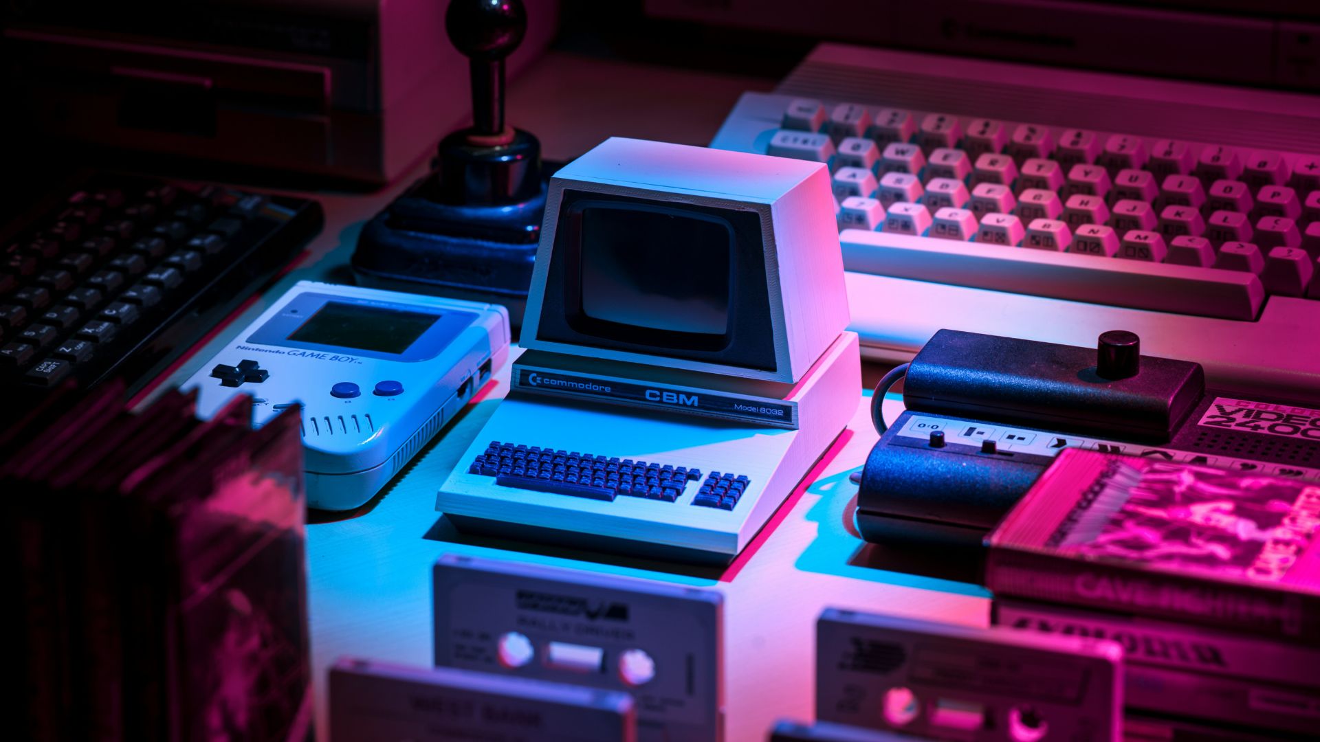 Vintage gray gaming console and joystick representing advanced computing technology.