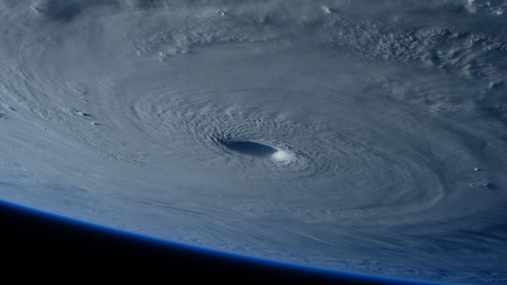 Satellite view of a hurricane spinning over the ocean