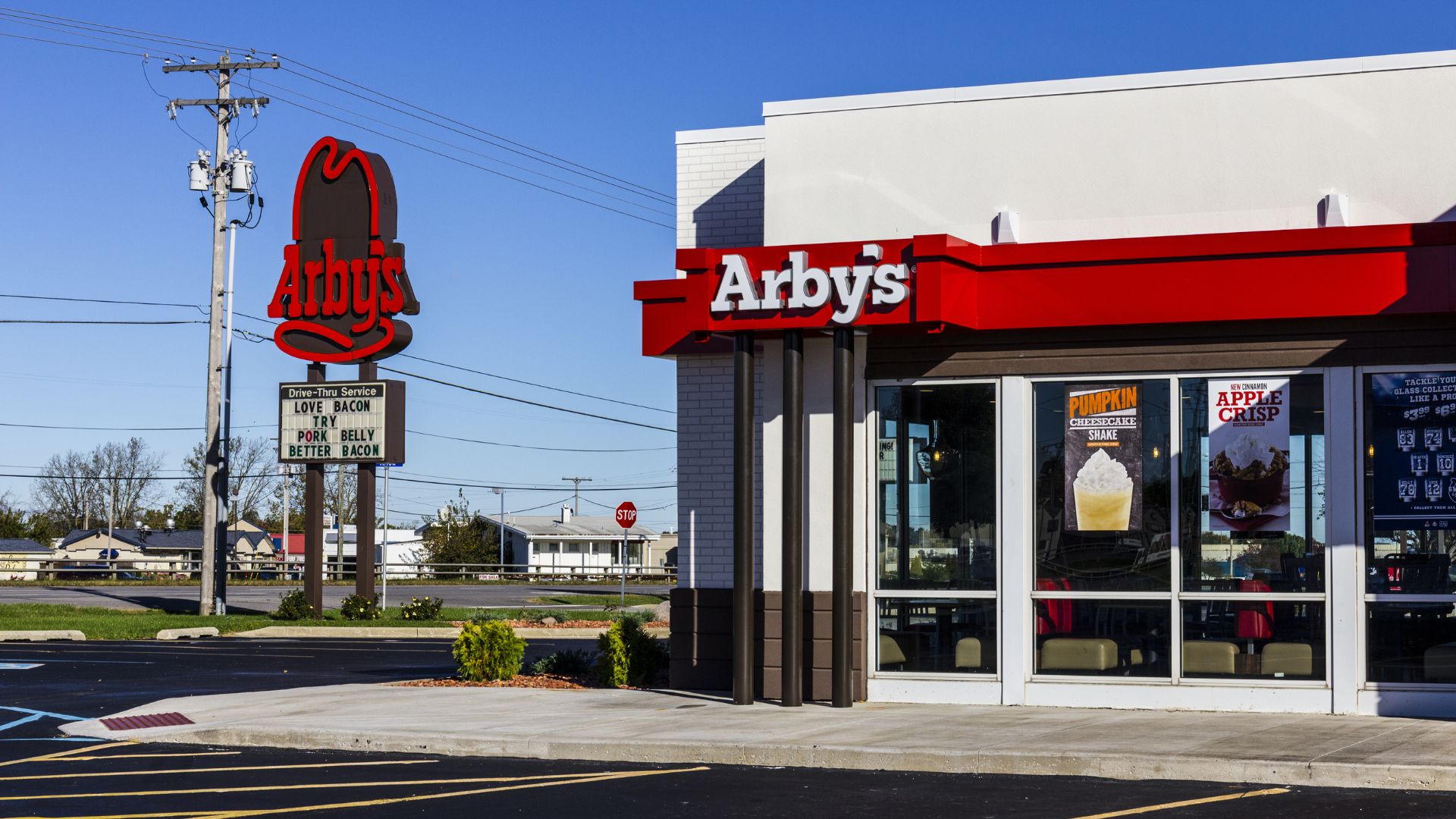 Arby’s retail sign in Indianapolis against a blue sky