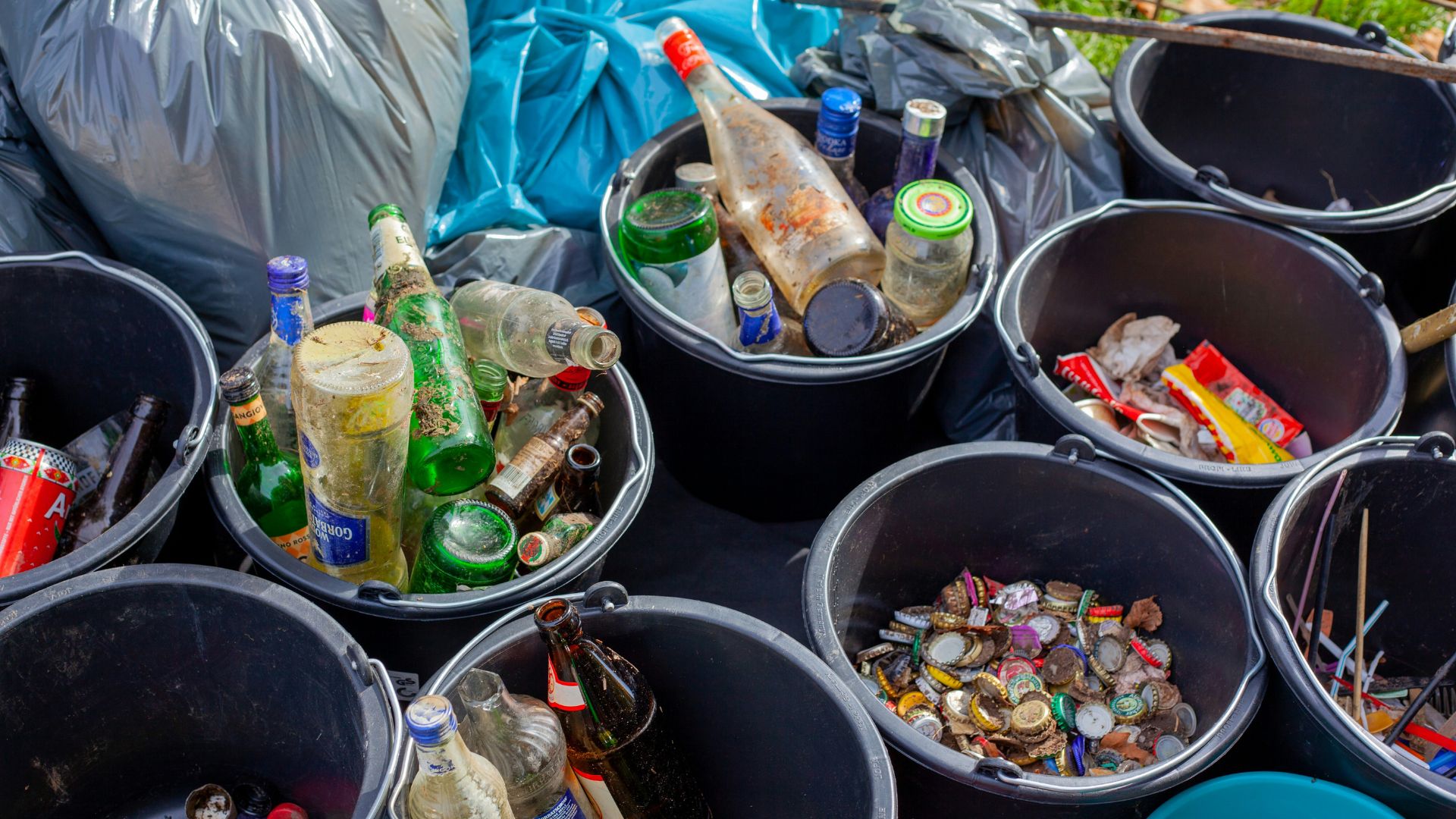 Assorted plastic bottles sitting in a black container