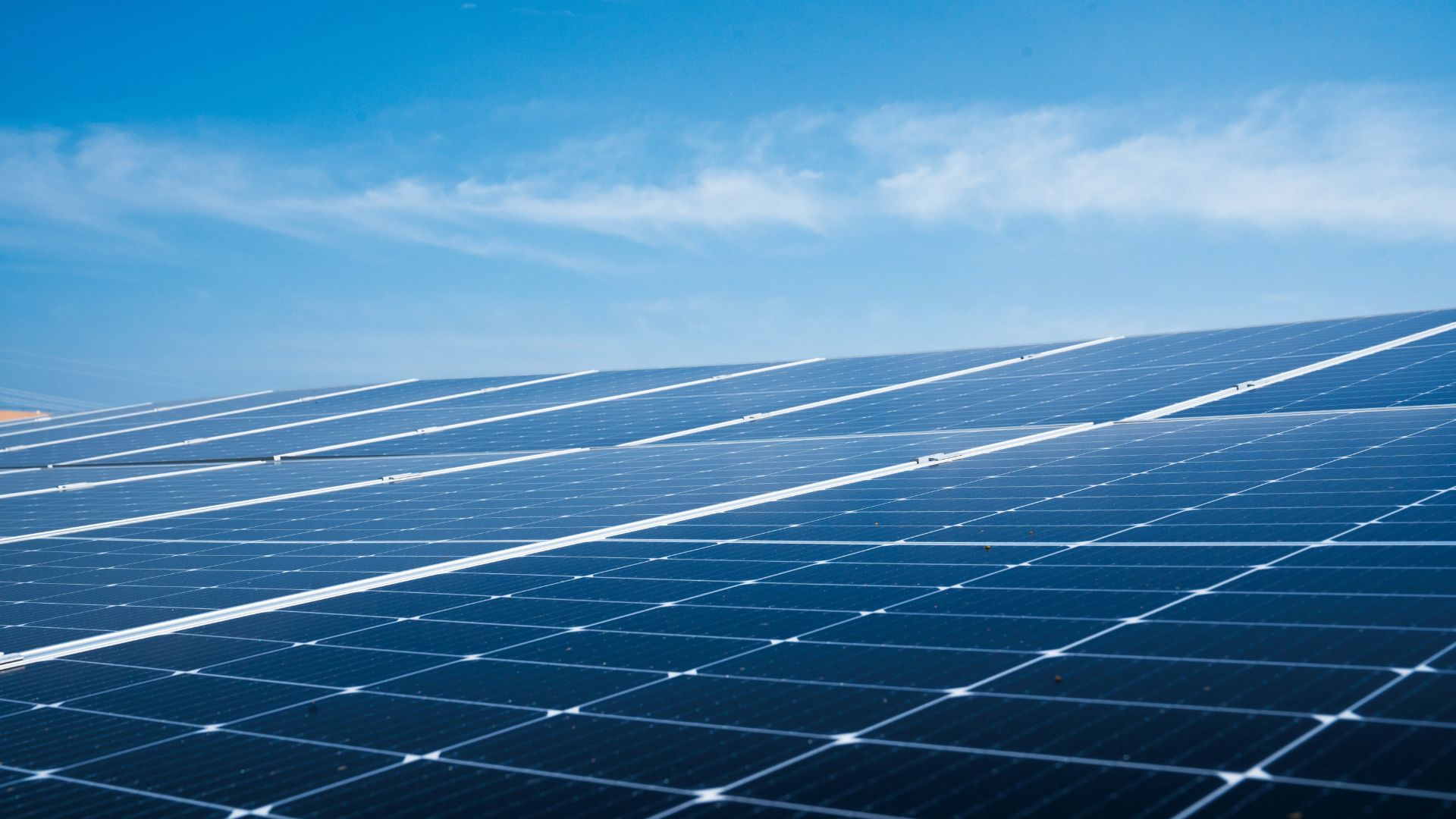 Solar panels installed on a residential roof under bright sun