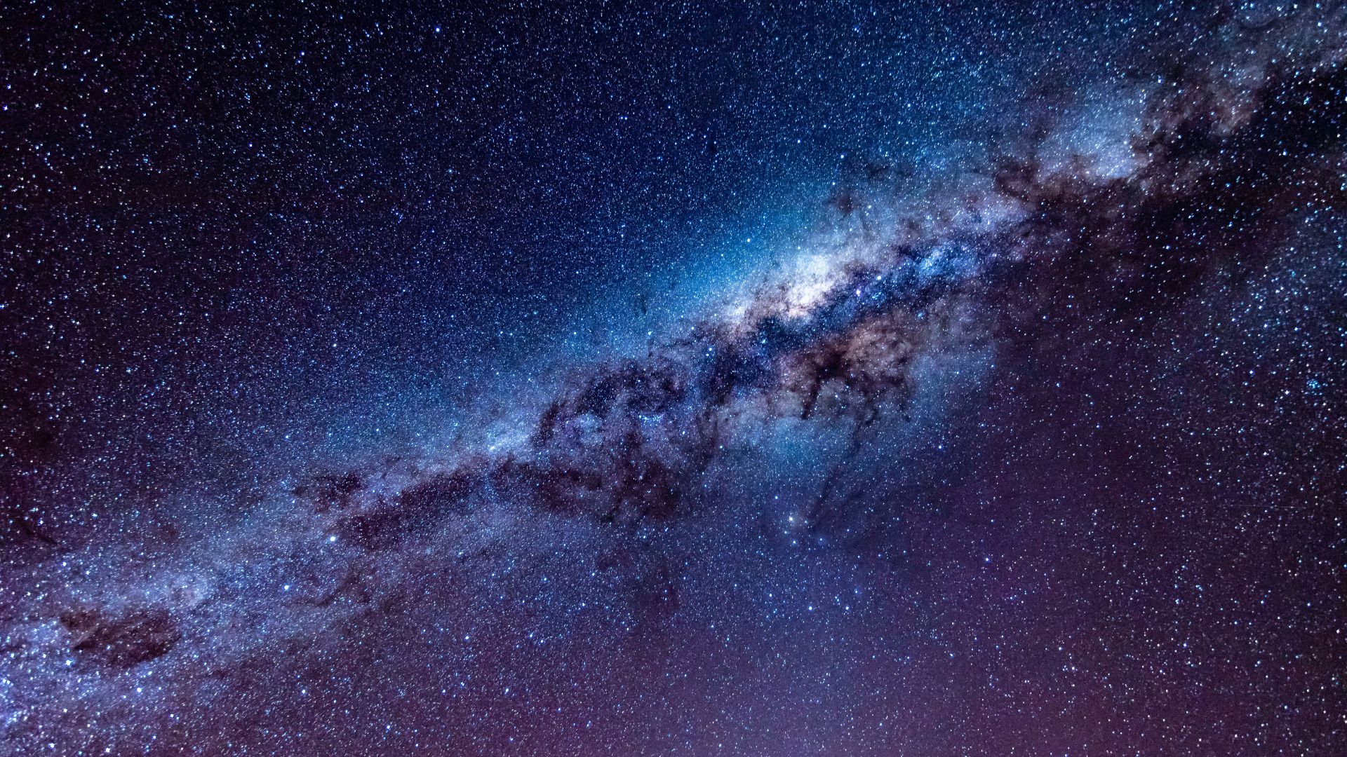 Milky Way arching across the night sky with bright dust lanes