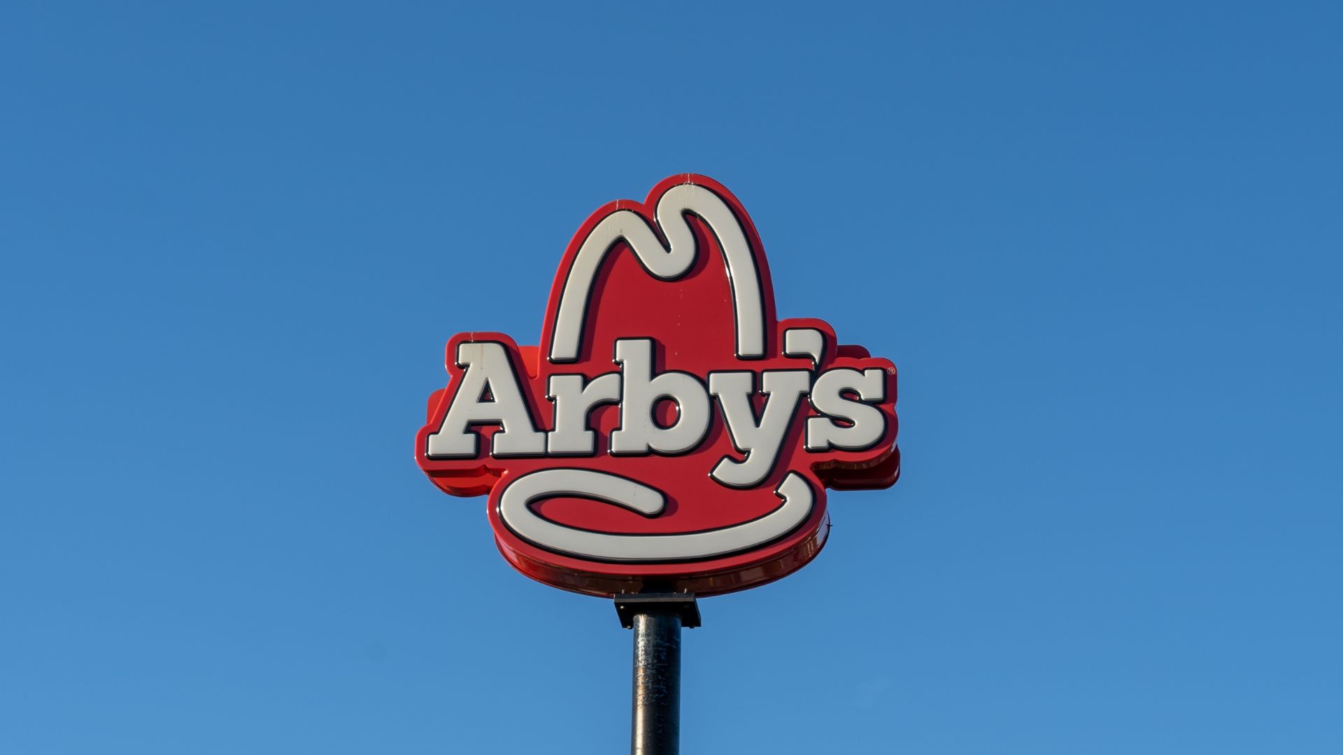 Arby’s restaurant in Orlando with red signage and drive-thru lane