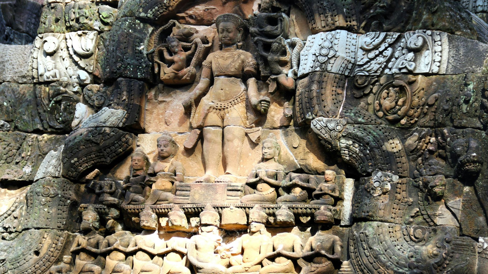 Statue of a woman surrounded by other classical sculptures