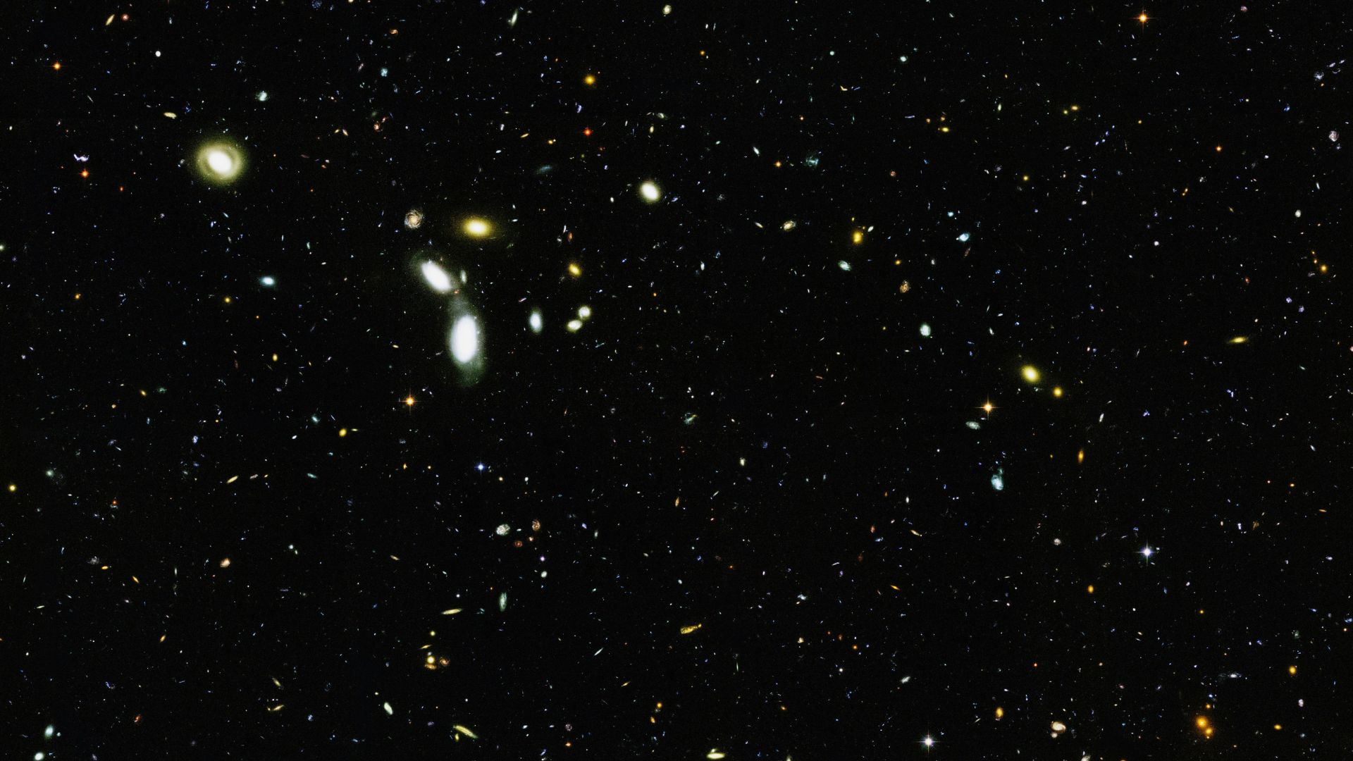 Dense star cluster shining across a dark night sky