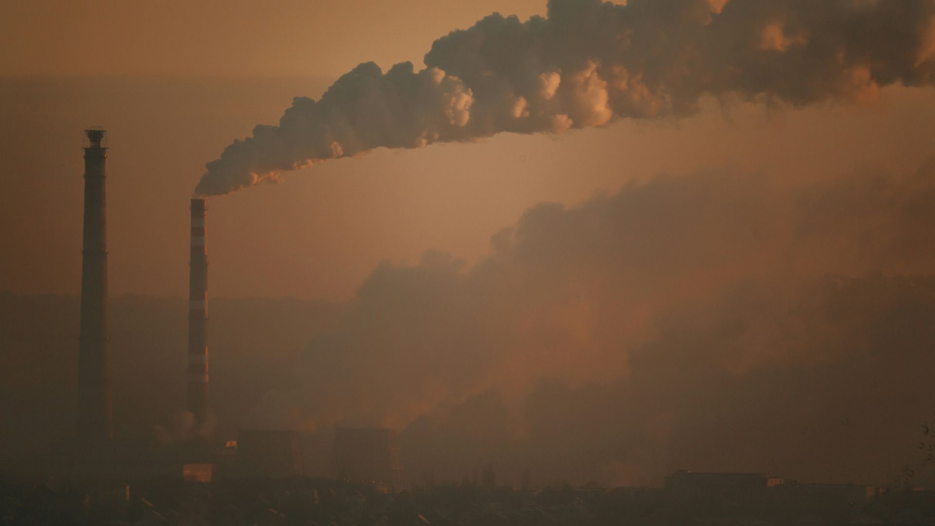 City skyline covered in haze under night sky