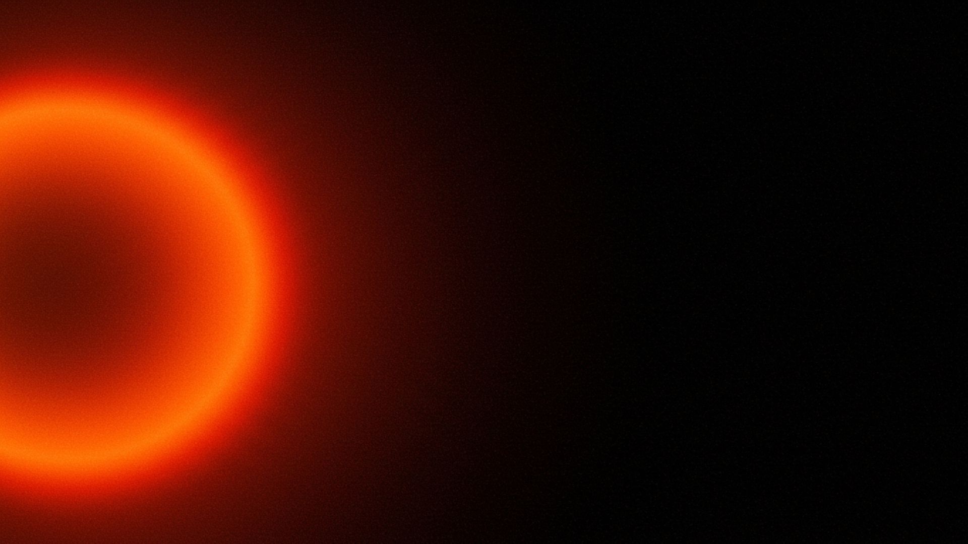 Minimalist space scene with a central red light suggesting an orbiting object