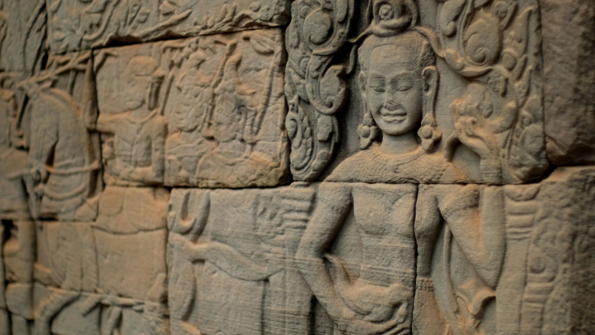 Detailed carvings etched into the surface of a stone wall