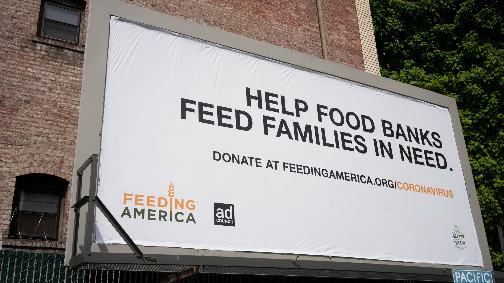 Feeding America food bank truck parked outside a warehouse