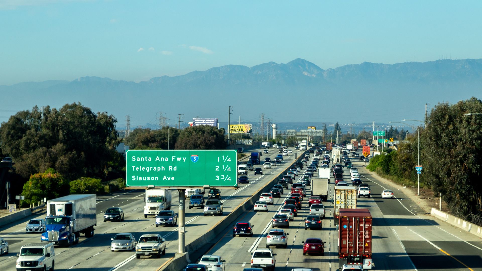 A busy Los Angeles freeway lined with cars during daytime