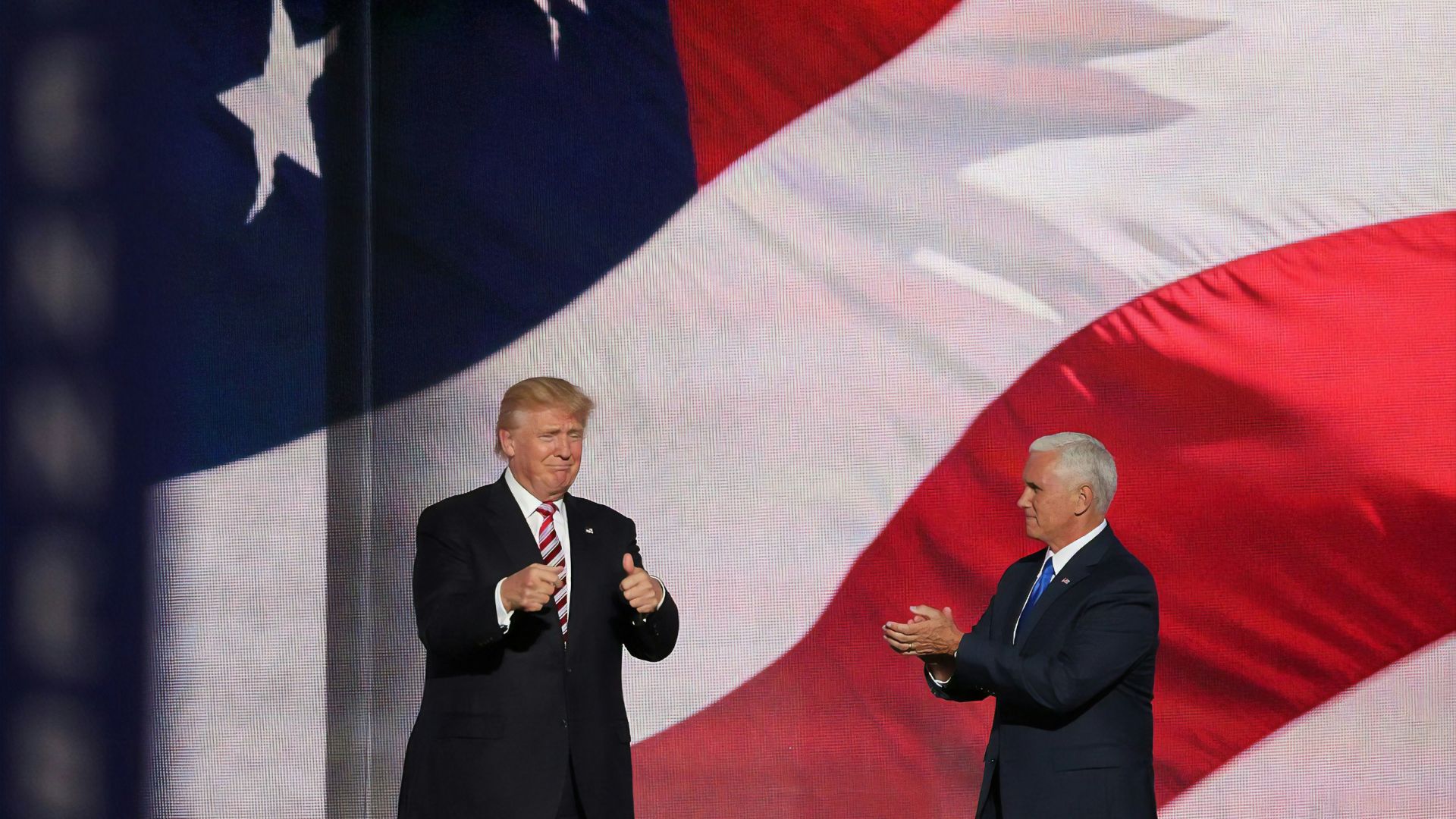 Donald Trump standing beside a man in a suit during a formal event