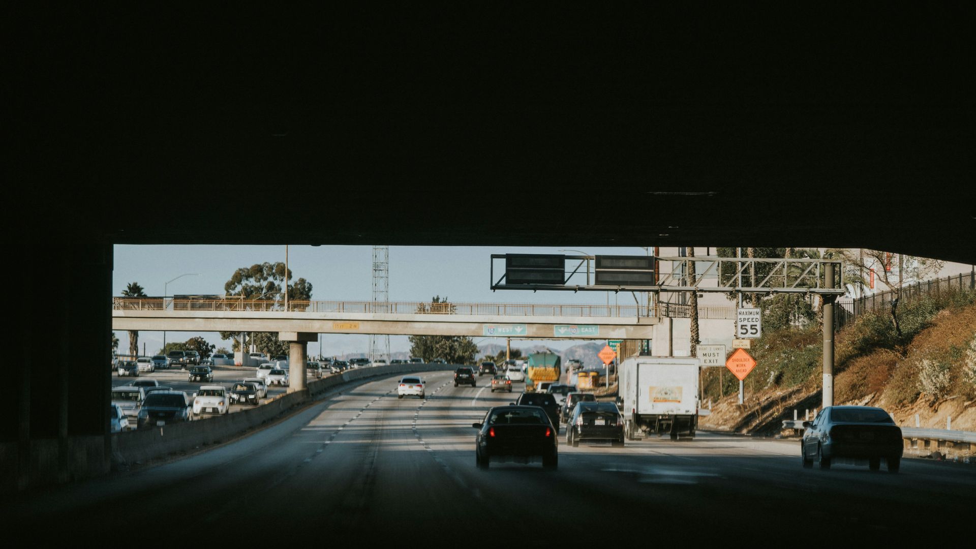 Rows of parked cars in a large outdoor parking area