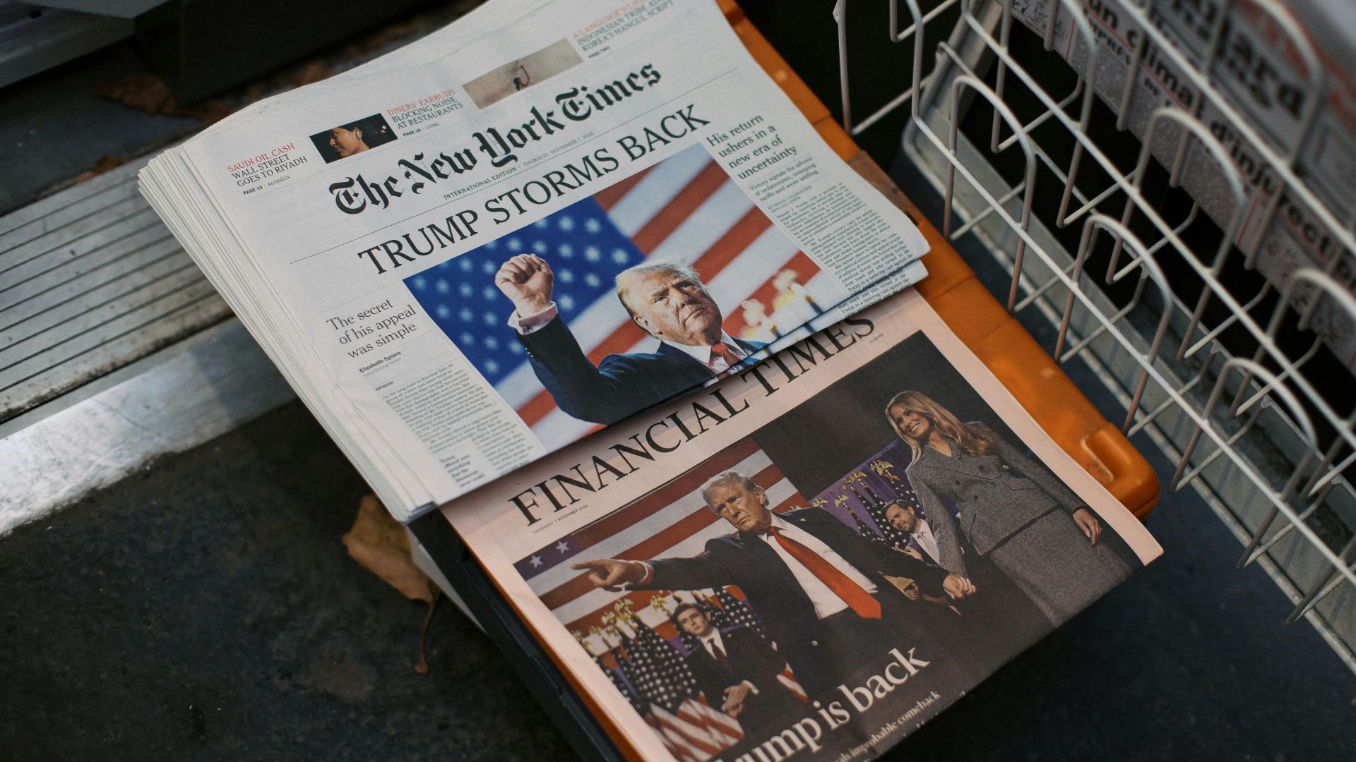 Folded newspaper placed on top of a stainless steel dishwasher