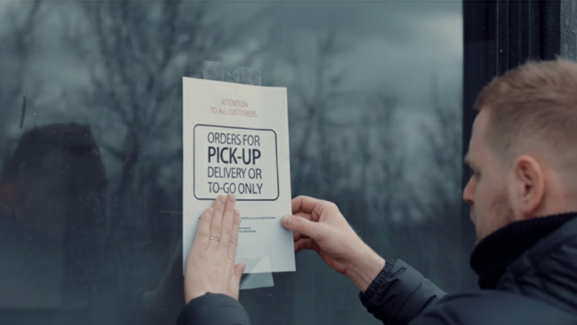 A Bay Area storefront with notices posted to the window.