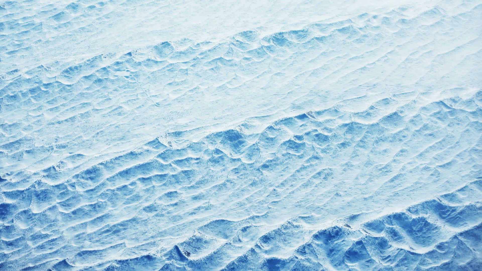 Ocean surface with rolling waves under natural light