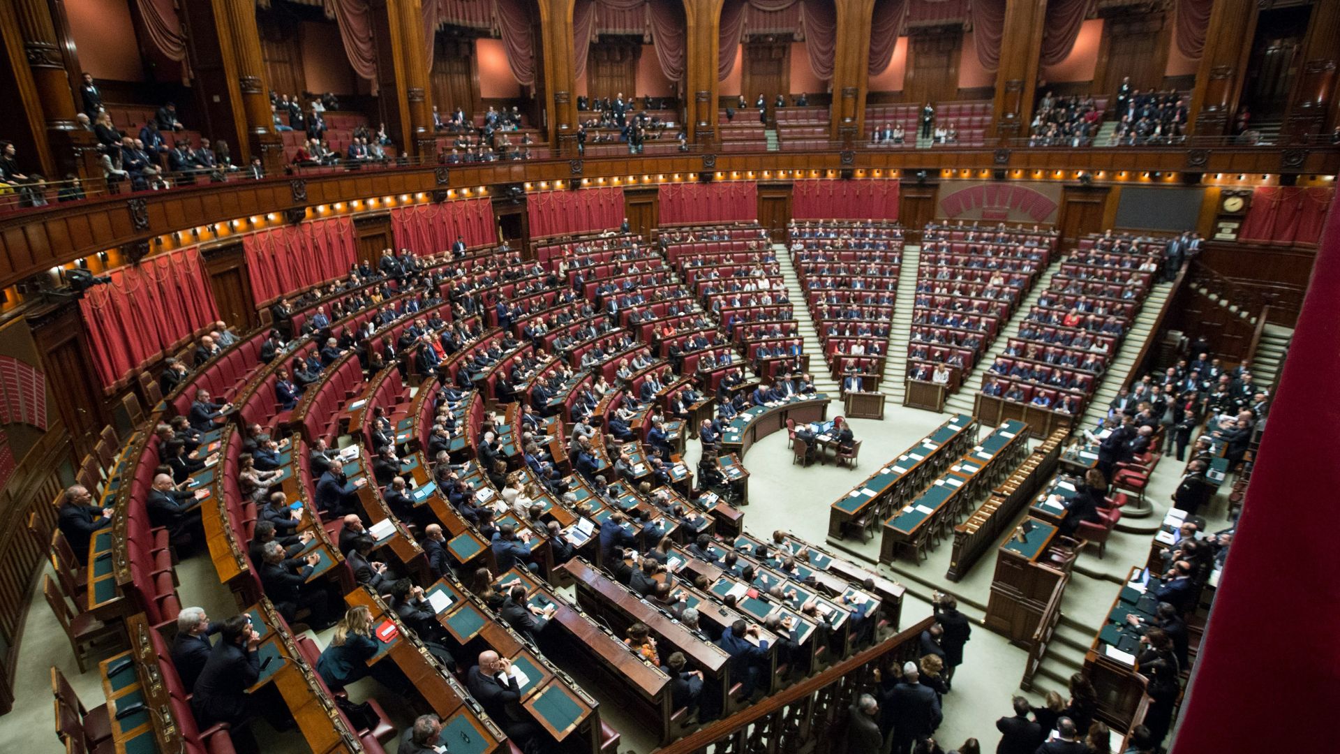 Overhead view of people seated together during a discussion.