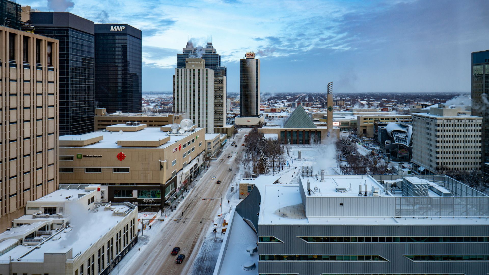 Urban school buildings surrounded by snow