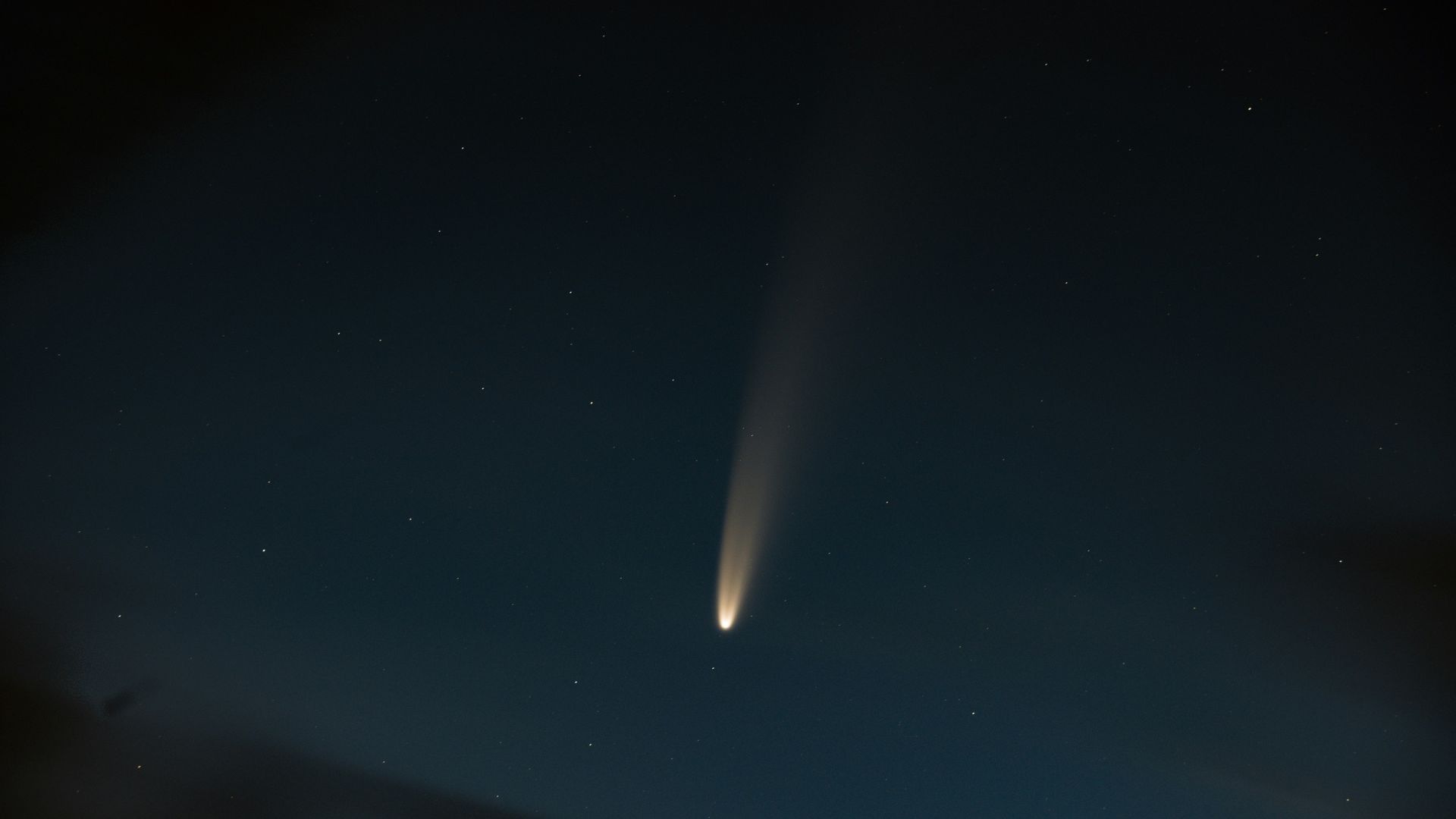Deep blue night sky with dense clusters of stars