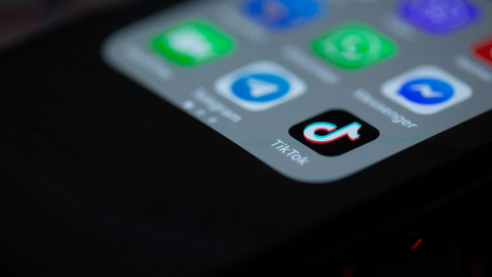 Smartphone resting on a dark fabric surface