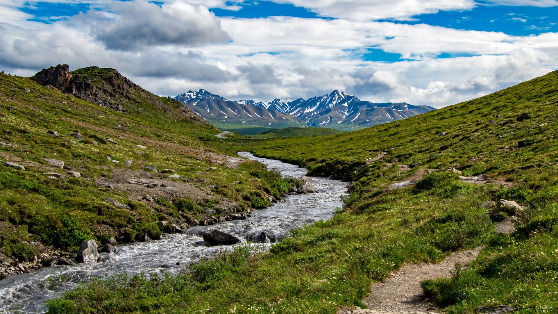 River flowing through a green valley near remote terrain