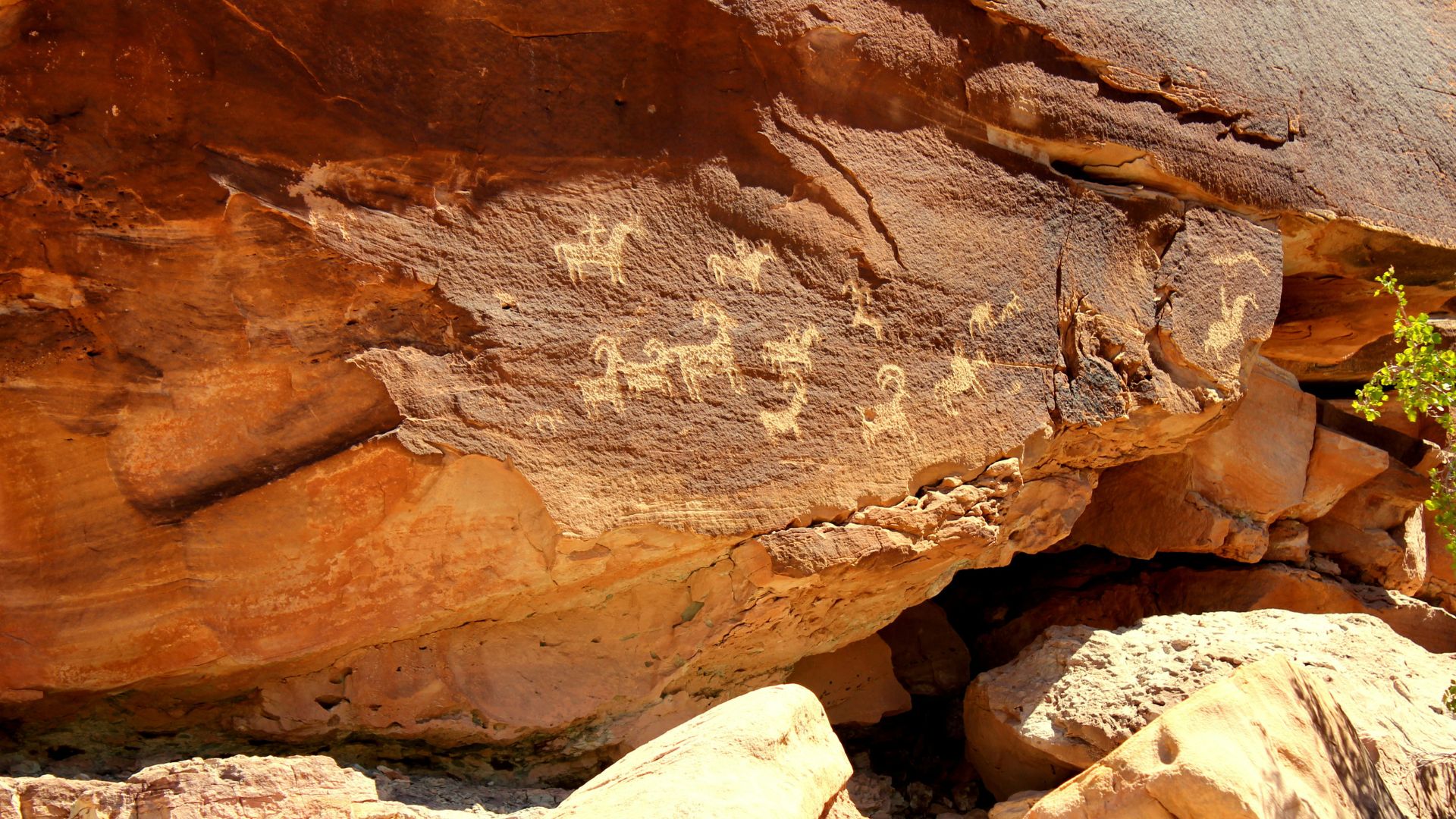 Large natural rock formation rising from an open landscape