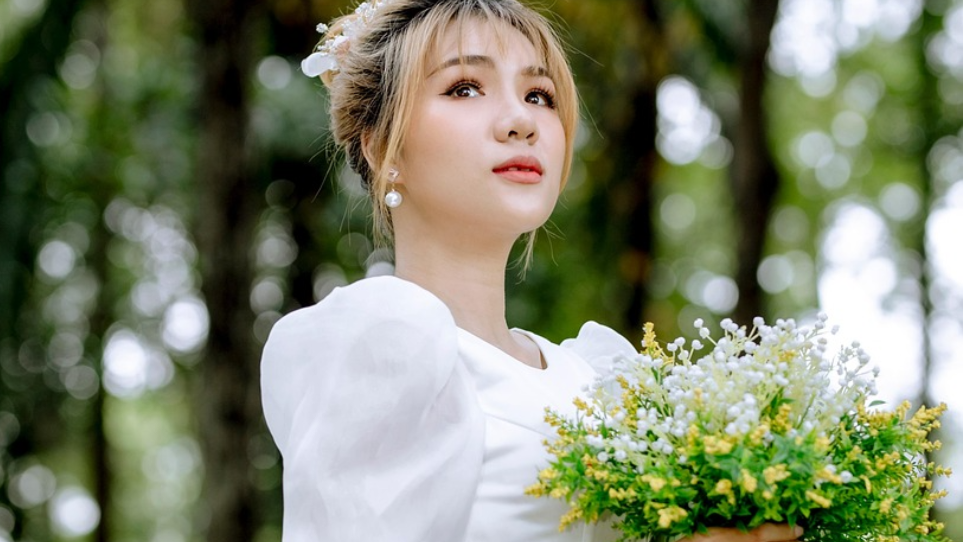 woman in her wedding dress holding a bouquet