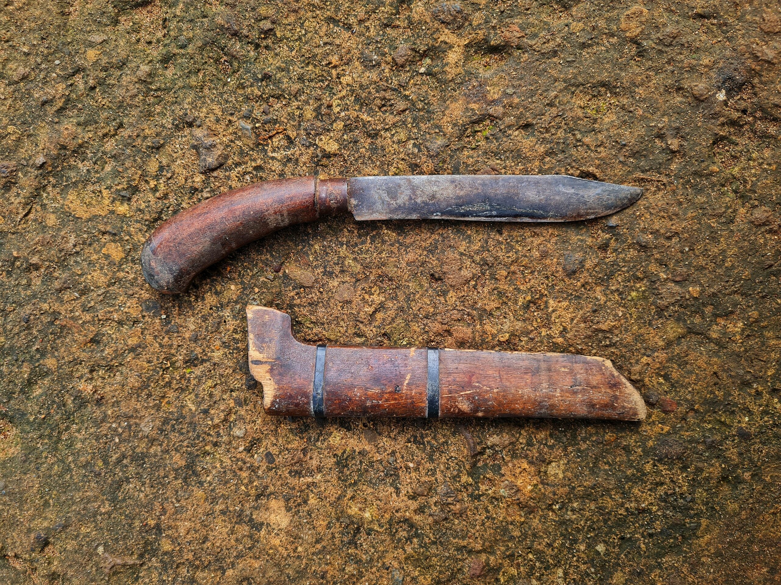 A metal blade with a wooden handle