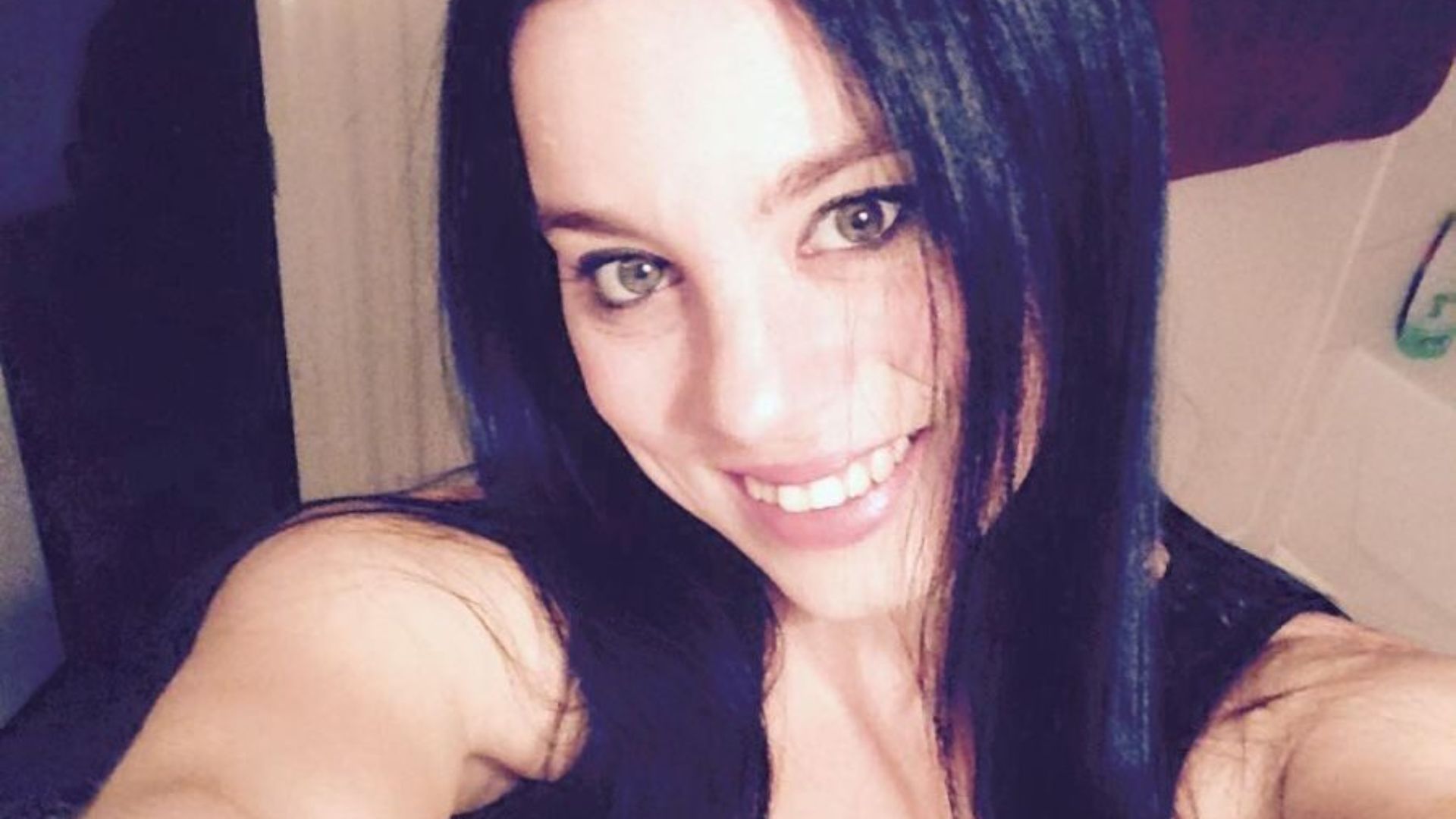 Woman taking a selfie from her cellphone cam.