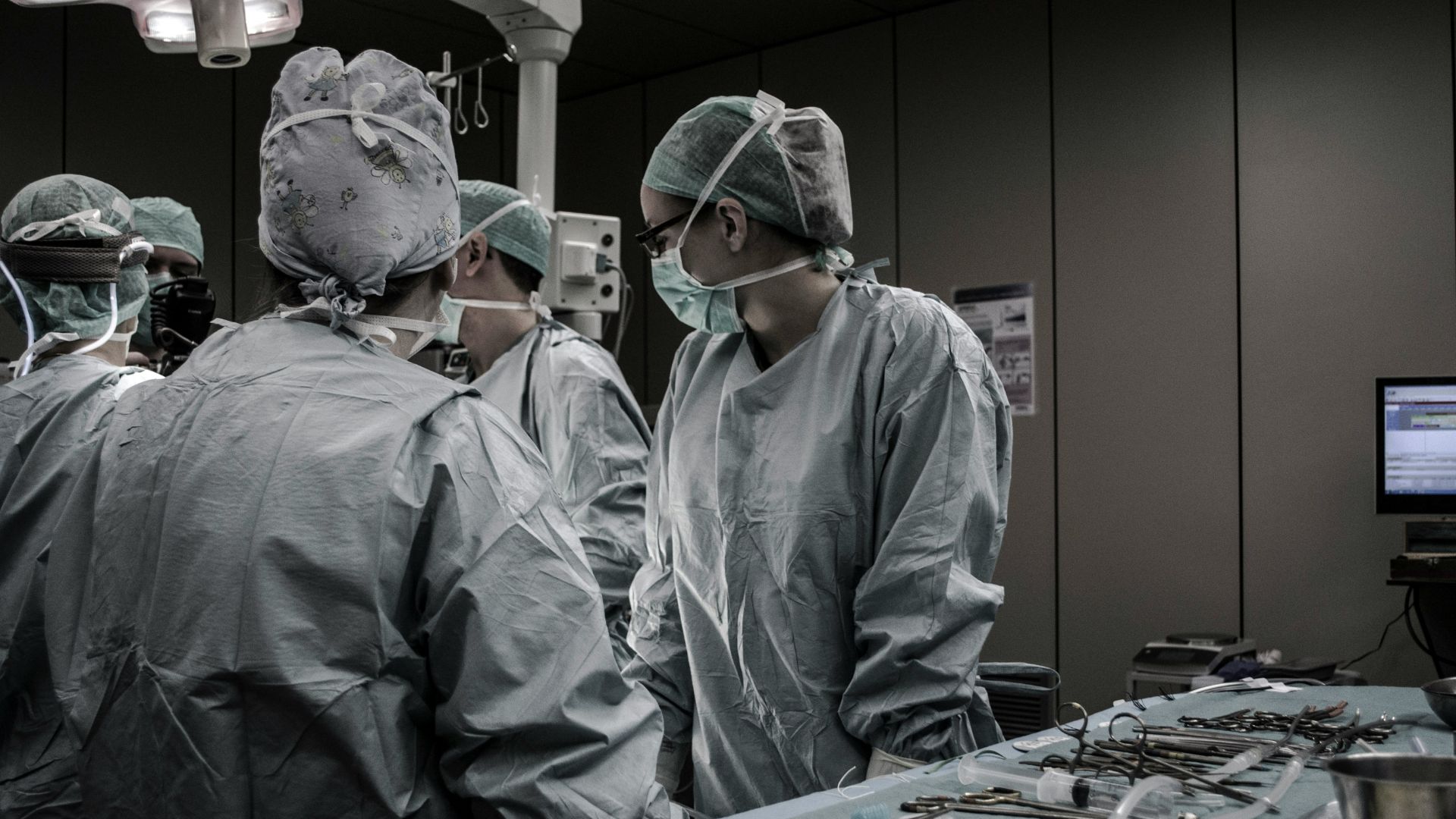 Medical professionals working together in a hospital treatment room