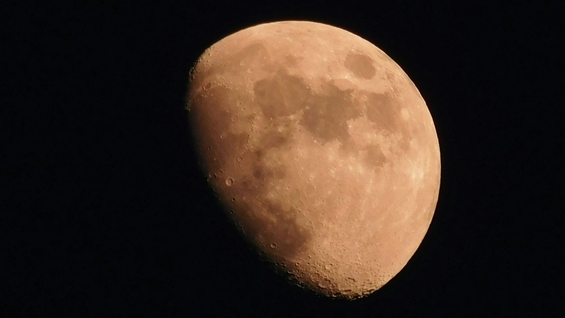 Full Moon isolated against a black background