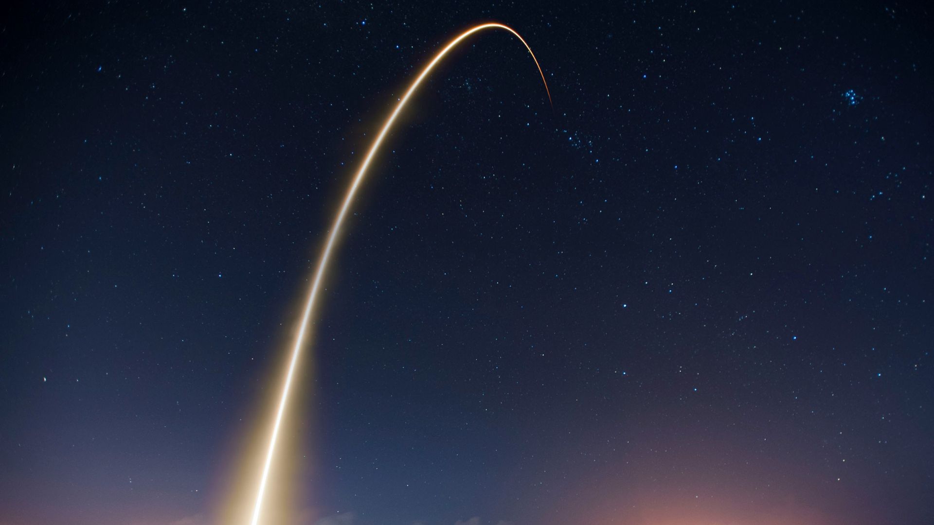 Night sky filled with stars and atmospheric glow