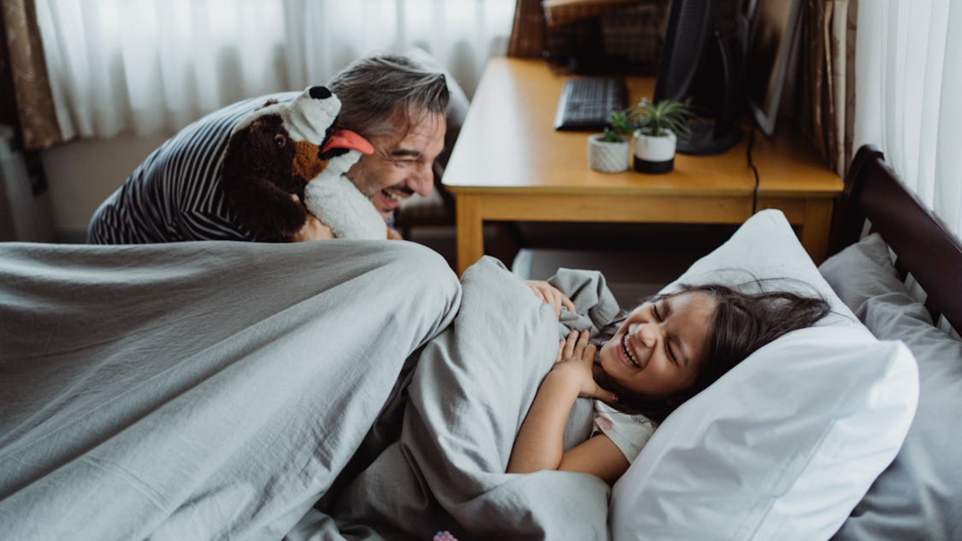 father playing with his daughter