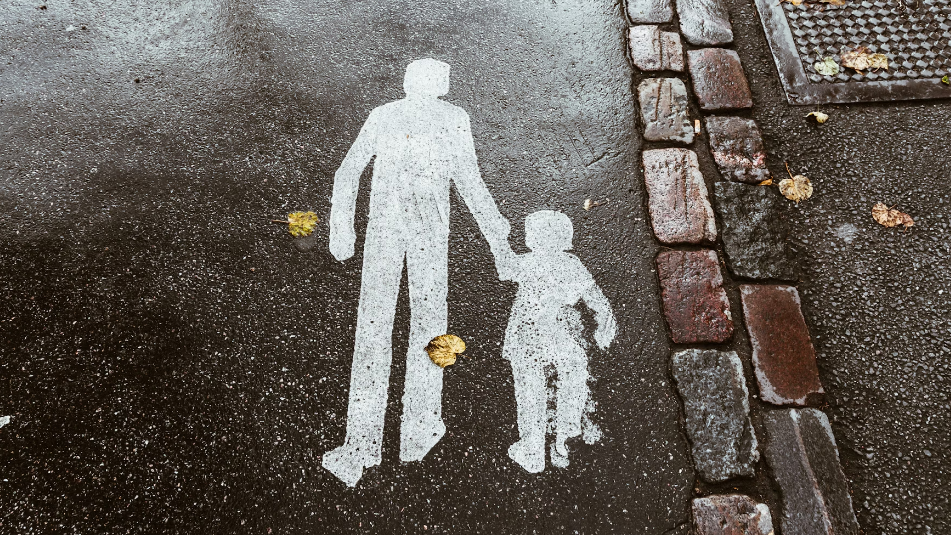 street art of parent with their child holding hands