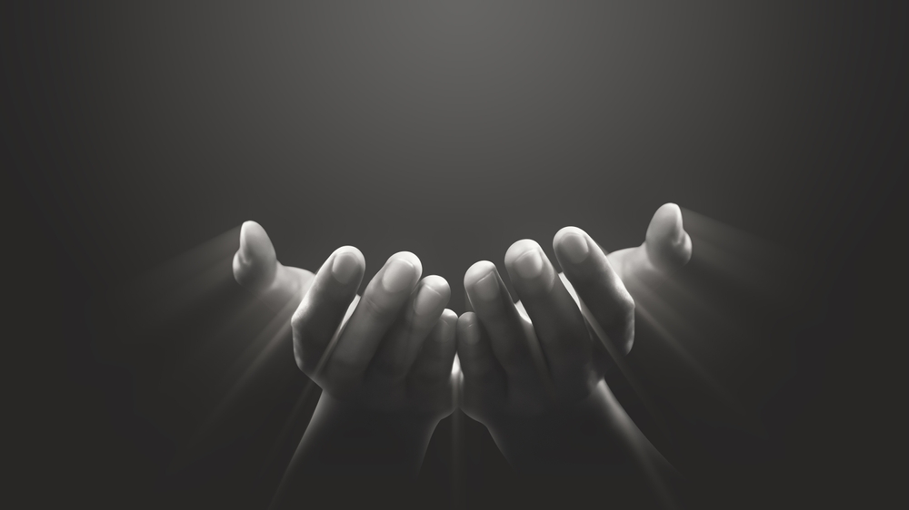 Hand prayer god faith holy worship on hope religion background of believe church pray jesus christian religious grace black white concept or love spiritual bible peace and spirit trust blessed light.