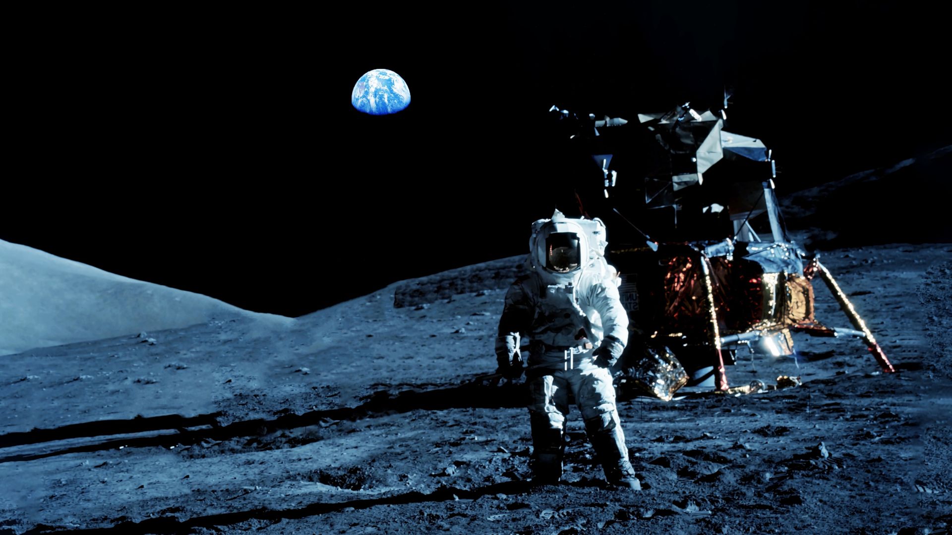 Astronaut standing on the lunar surface with Earth visible in the background