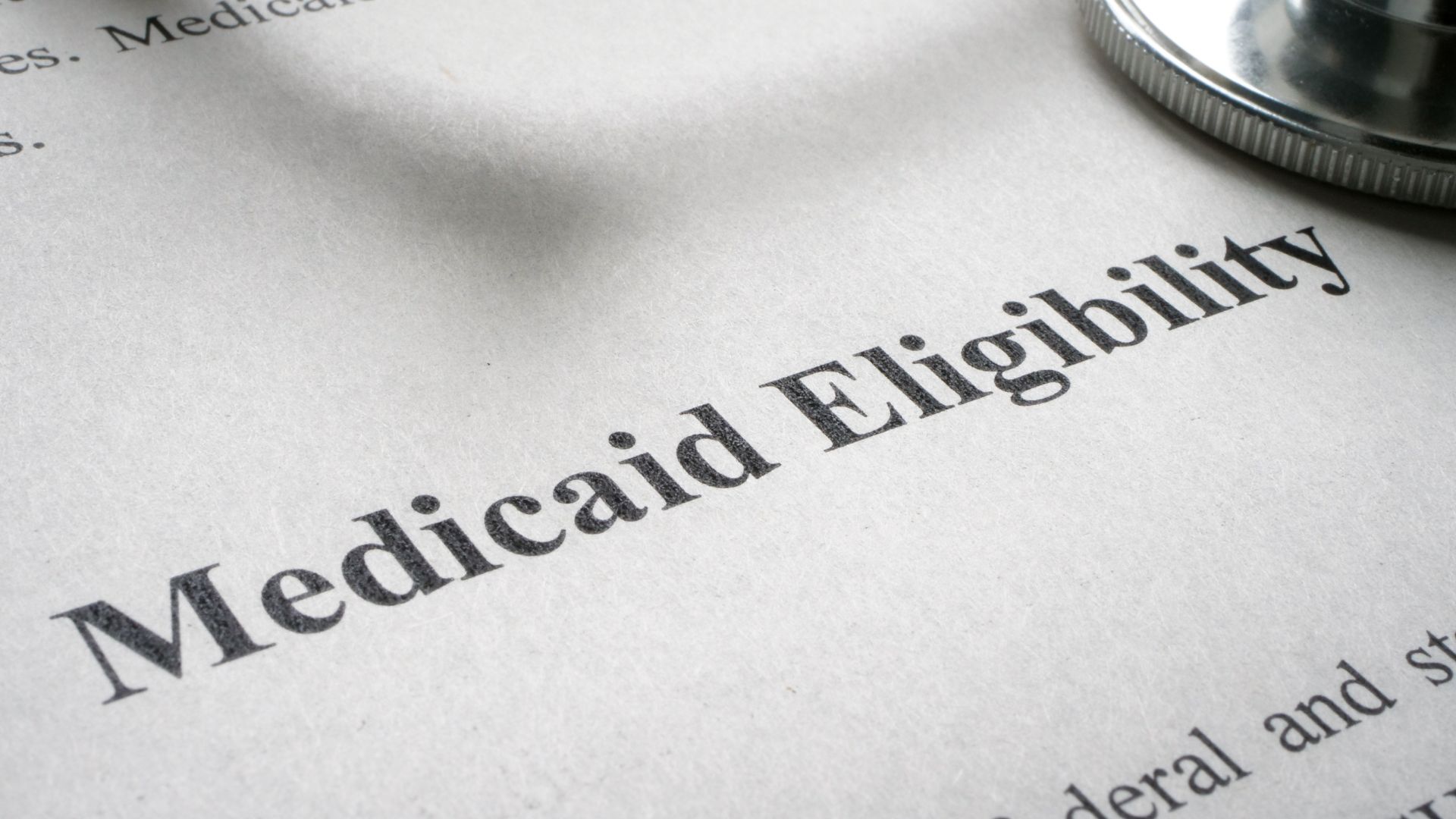 Medicaid eligibility information form with a stethoscope placed on top