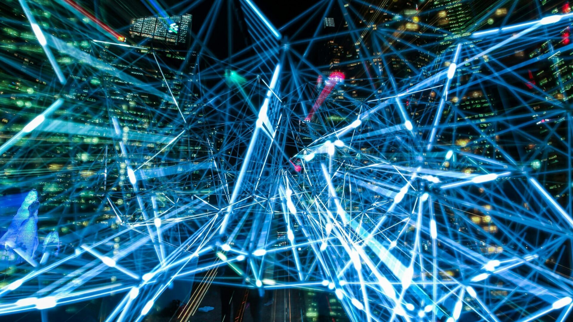 Blue light trails forming an abstract background representing data flow, technology, and digital networks.